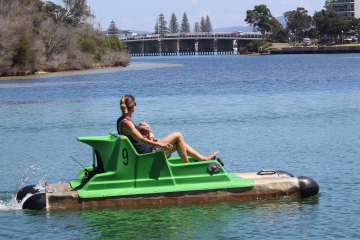 Aqua bike woman and child enjoying relaxing Forster Houseboats hire NSW